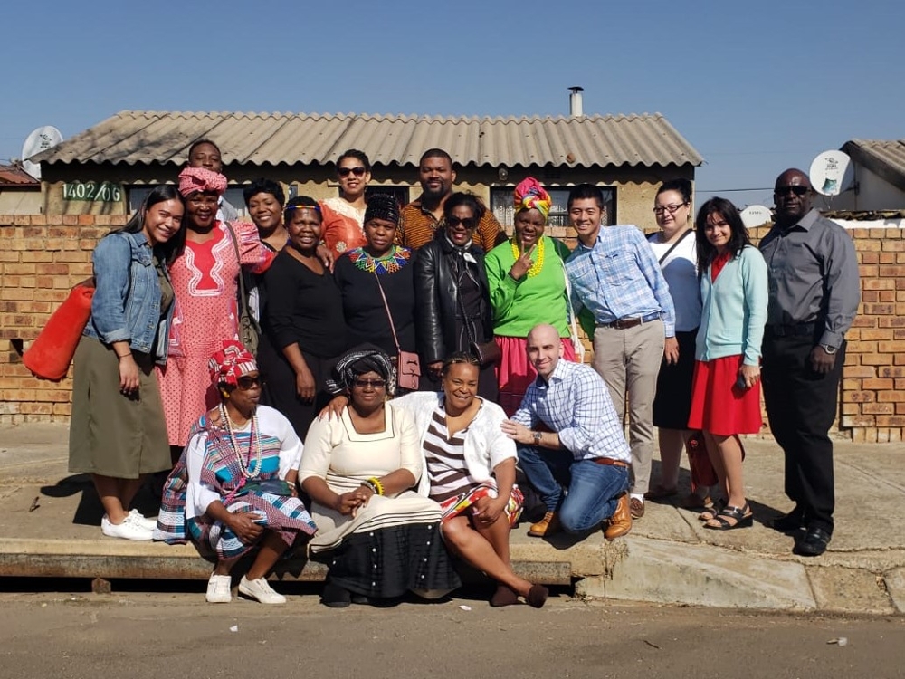Students and their host families in South Africa.